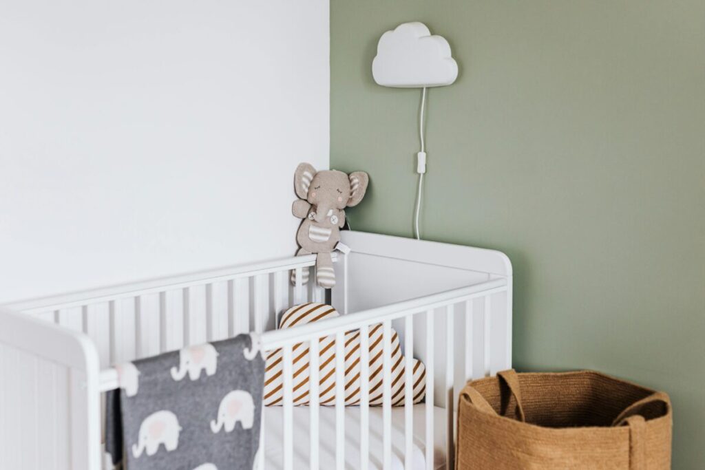 A calm baby sleeping naturally, proving that baby sleep myths cereal in bottle are unnecessary for a restful night.
