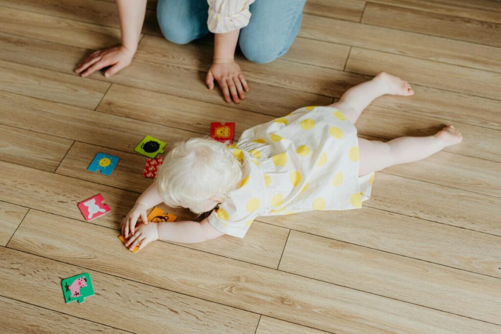 A happy 10-month-old following a daily routine, showing a better way to manage energy without adding cereal to bottle to help baby sleep.