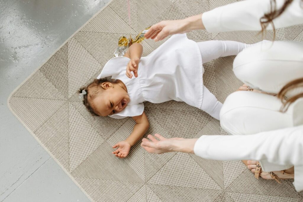 Mother practicing gentle parenting and knowing what to say during a toddler tantrum to validate emotions