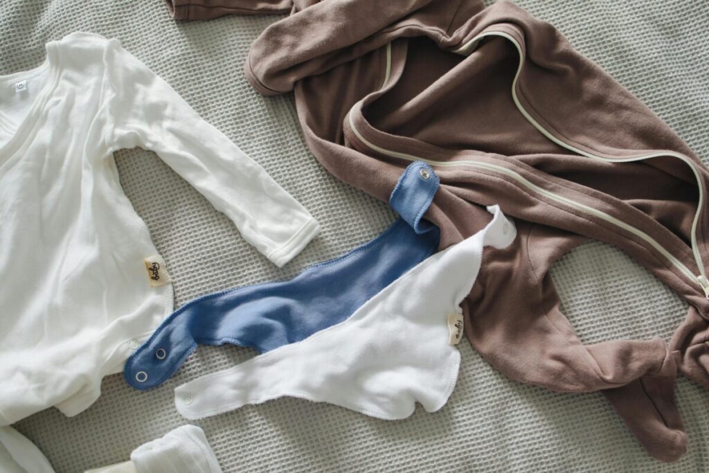 The only items you need on a minimalist hospital bag checklist for baby: two different sized outfits.
