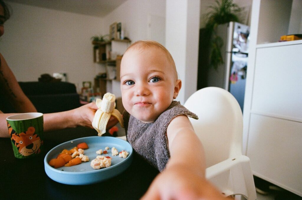 Using essential baby travel gear for international flights, including suction toys and soft snacks, to entertain an infant during
