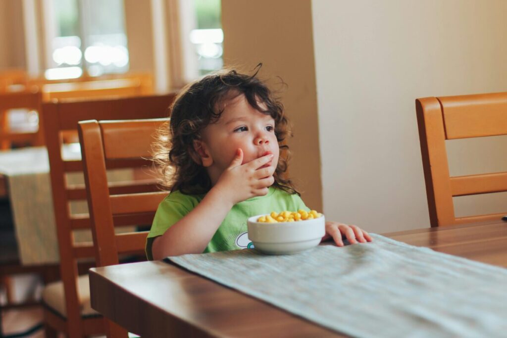 Toddler exploring 17 month old developmental milestones while playing on the floor