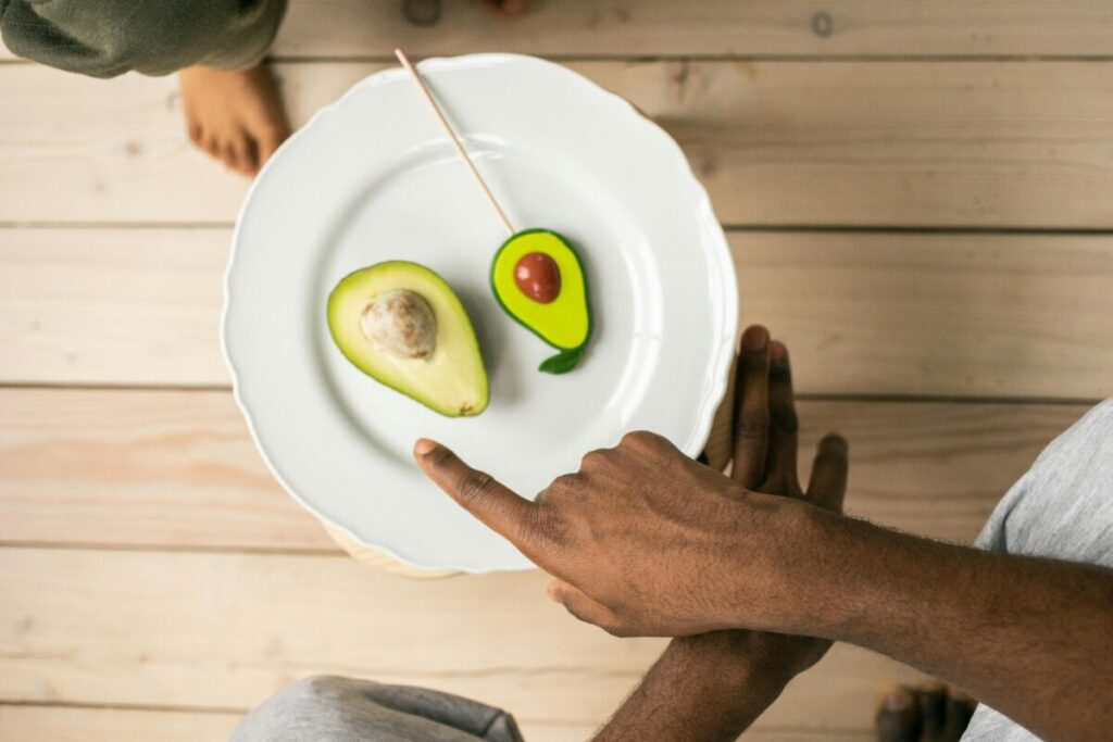 Simple and nutrient-dense toddler snack plate with healthy fats and fruits.