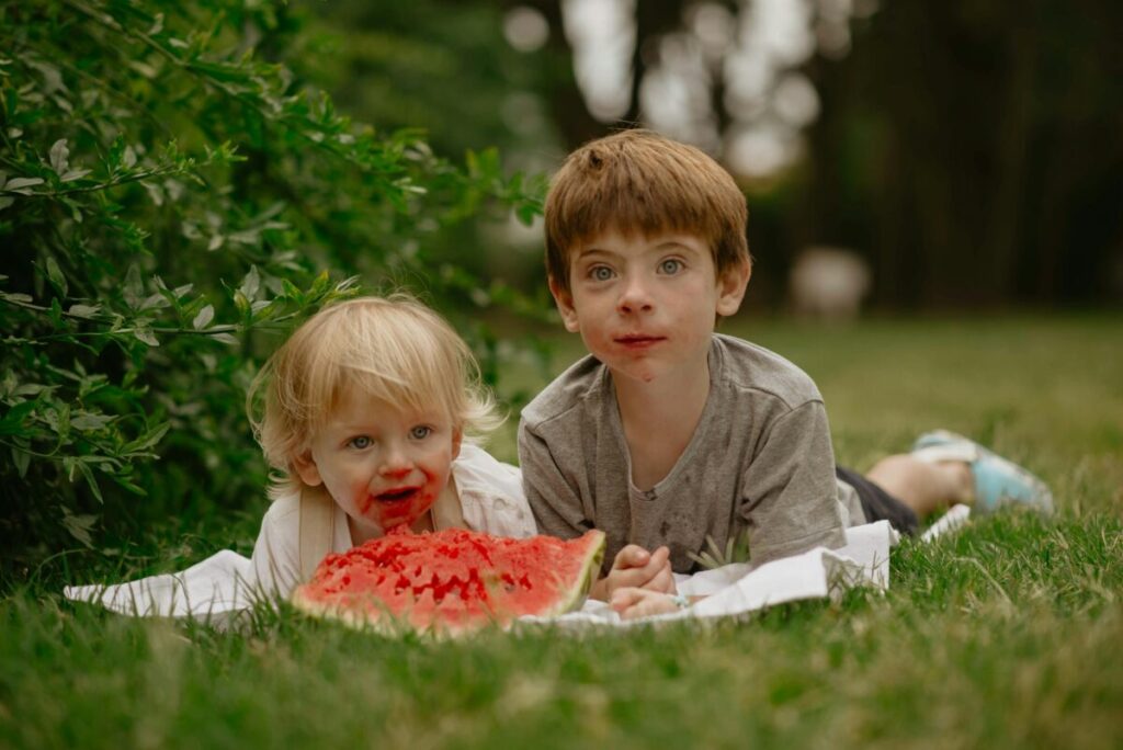 Baby eating watermelon as one of the best summer fruits for babies