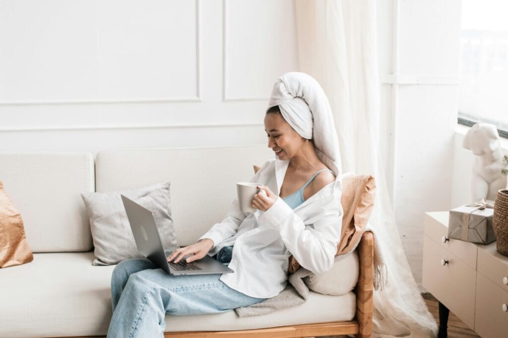 A working mom at her desk, successfully managing her day using first trimester survival tips for working moms.