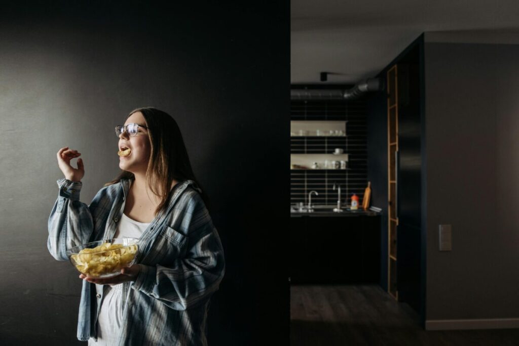A hungry mom-to-be enjoying a healthy snack during her second trimester