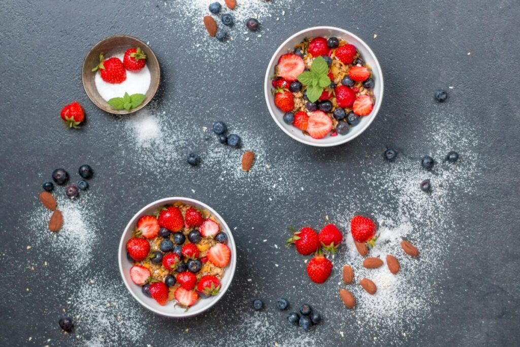 Toddler enjoying a healthy berry bowl, one of the best easy toddler meals for tired moms.
