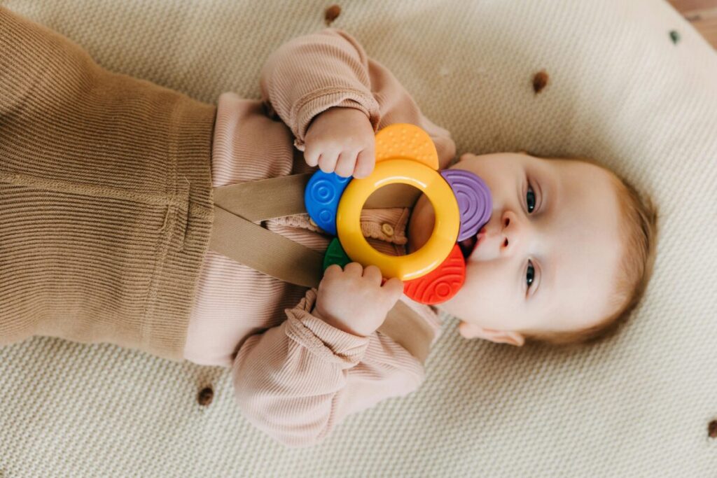Baby biting a silicone toy for baby teething relief that actually works