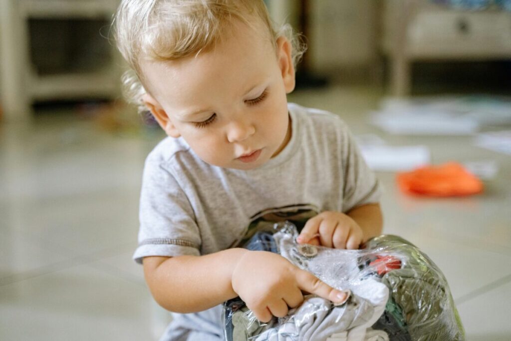 Toddler learning independence during developmental milestones