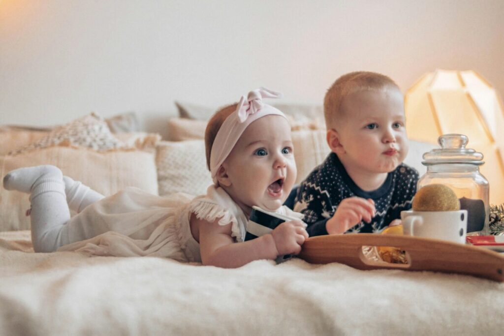 A parent trying to feed a baby refusing solids in a high chair, illustrating common feeding challenges and developmental stages