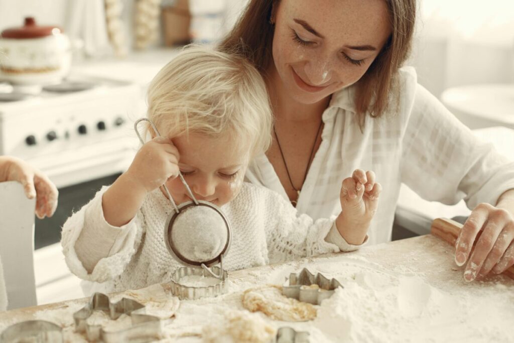 Toddler playing with food and showing signs baby is full after losing interest in eating