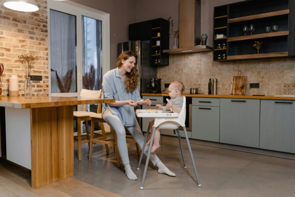 A mother sitting on her hands to avoid a finger sweep while learning how to tell difference between gagging and choking