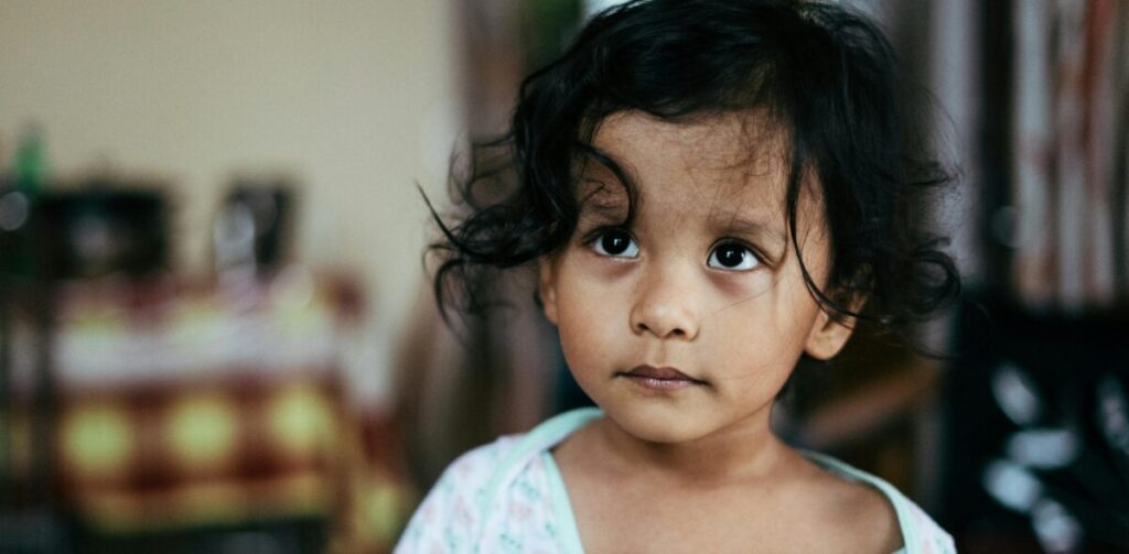 A baby refusing food suddenly due to boredom or distraction rather than being full