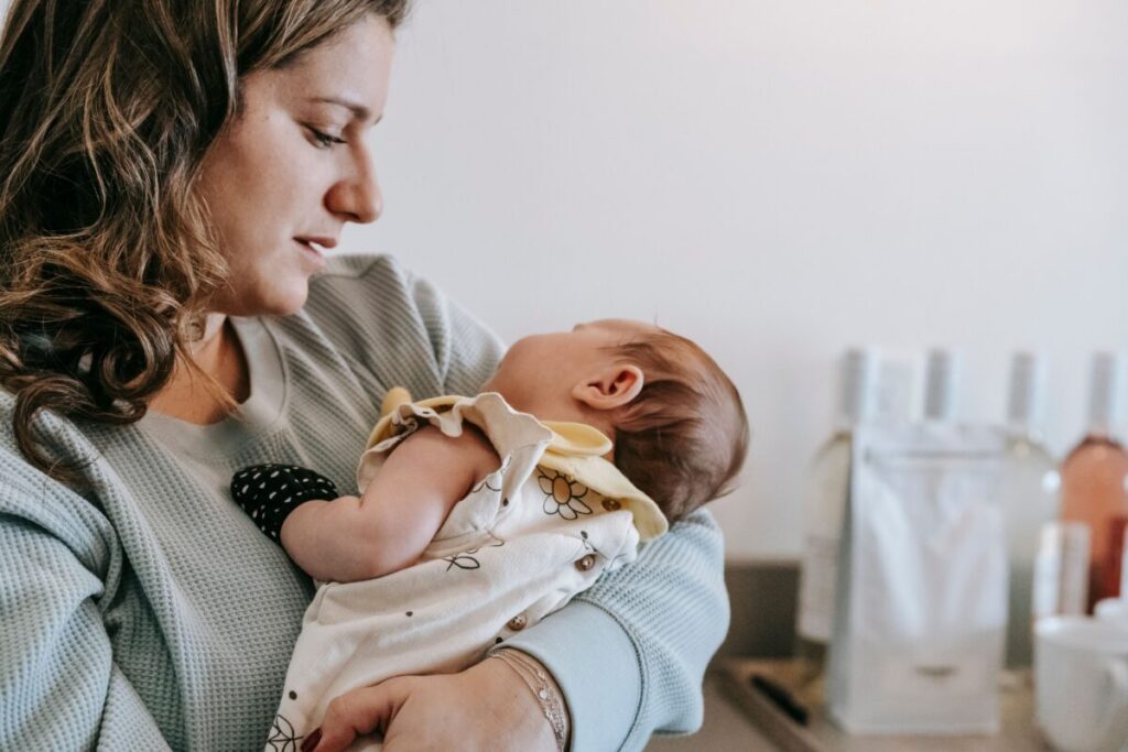 Infant congestion relief: a parent comforting a baby who has a cold at night.
