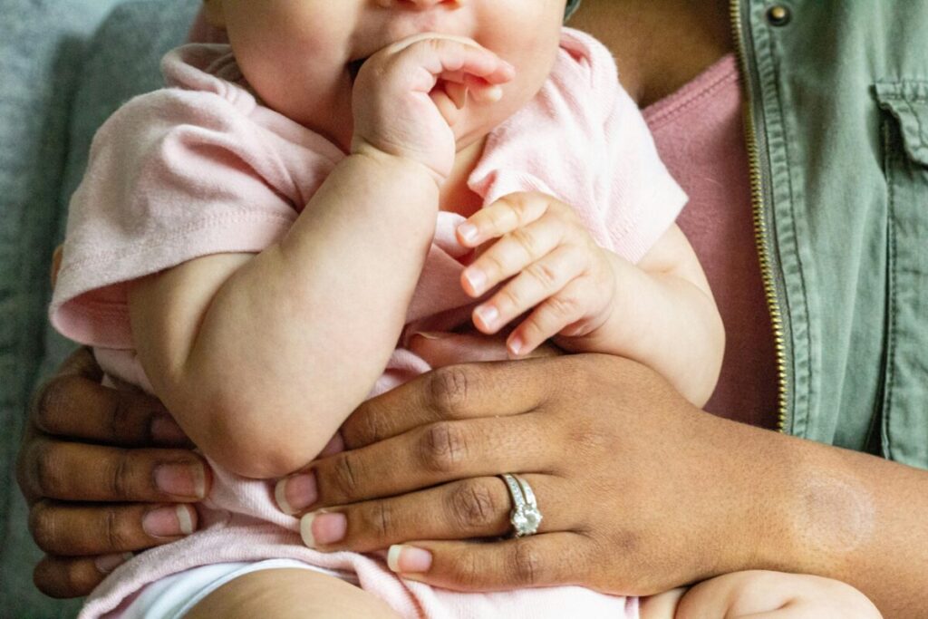 Illustration explaining why to avoid finger sweeps during a baby gagging reflex to prevent actual choking.