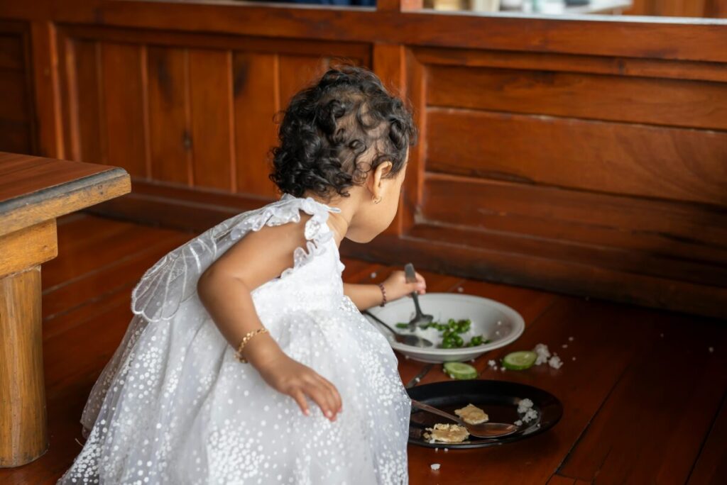 A toddler refusing to eat, illustrating a classic toddler food strike with a messy mealtime scene.