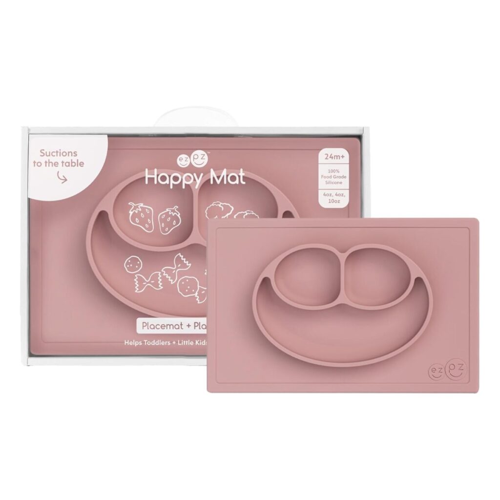 Close-up view of the durable, non-toxic, food-grade silicone ezpz Happy Mat, highlighting its secure suction base preventing toddler spill disasters.