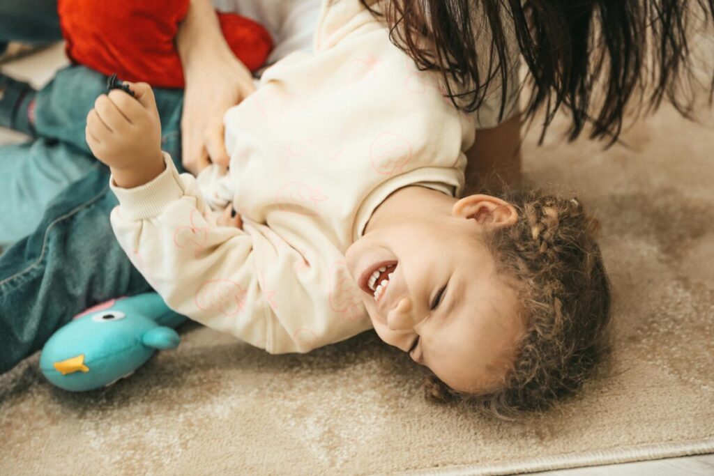 Parent and child enjoying a calm moment, a sign of gentle discipline for toddlers working