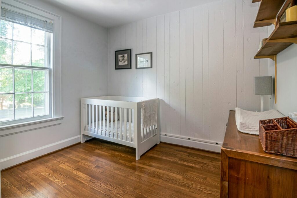 A clean and organized minimalist nursery setup for a stress-free baby room