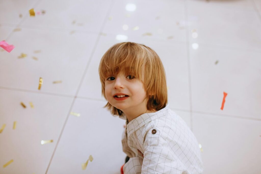 A frustrated toddler having a daytime meltdown on the rug, a common phase when navigating 19 month milestones