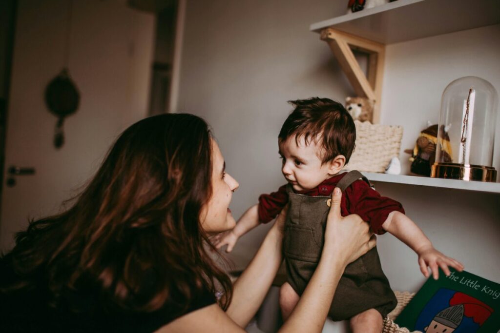 A parent checking for signs of dehydration in babies, one of the key steps on how to keep baby hydrated in summer