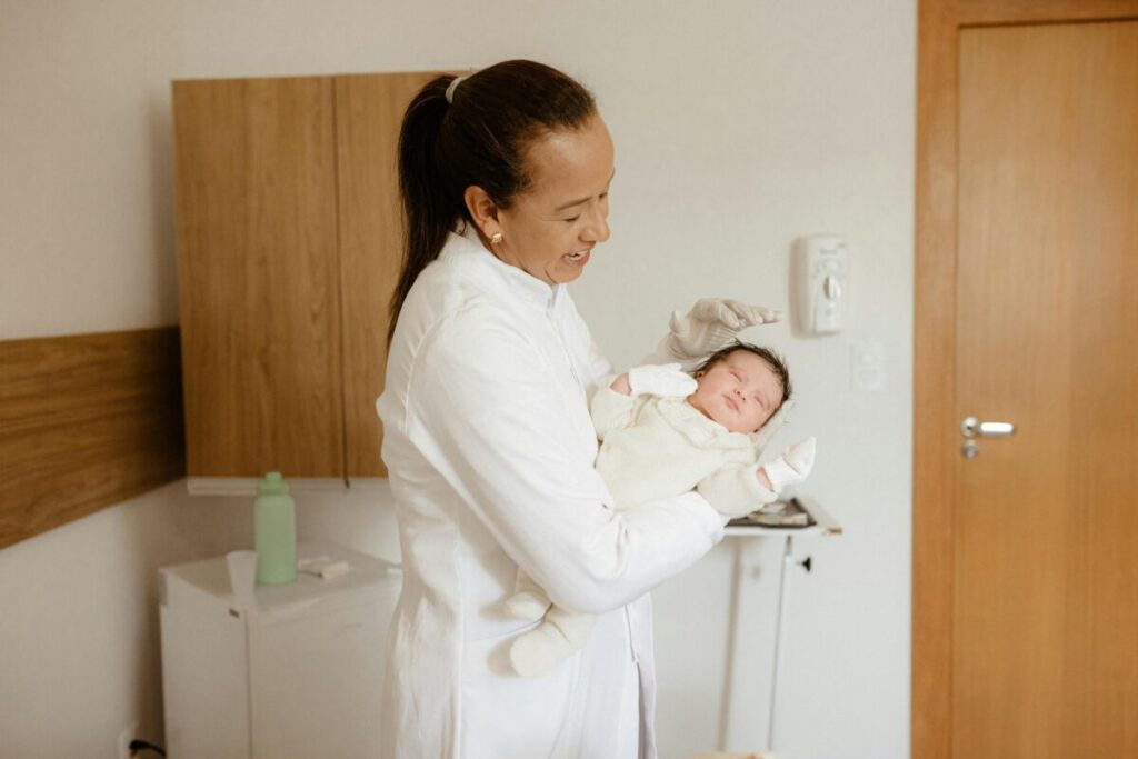 Mother talking to pediatrician about infant gas drops and colic remedies