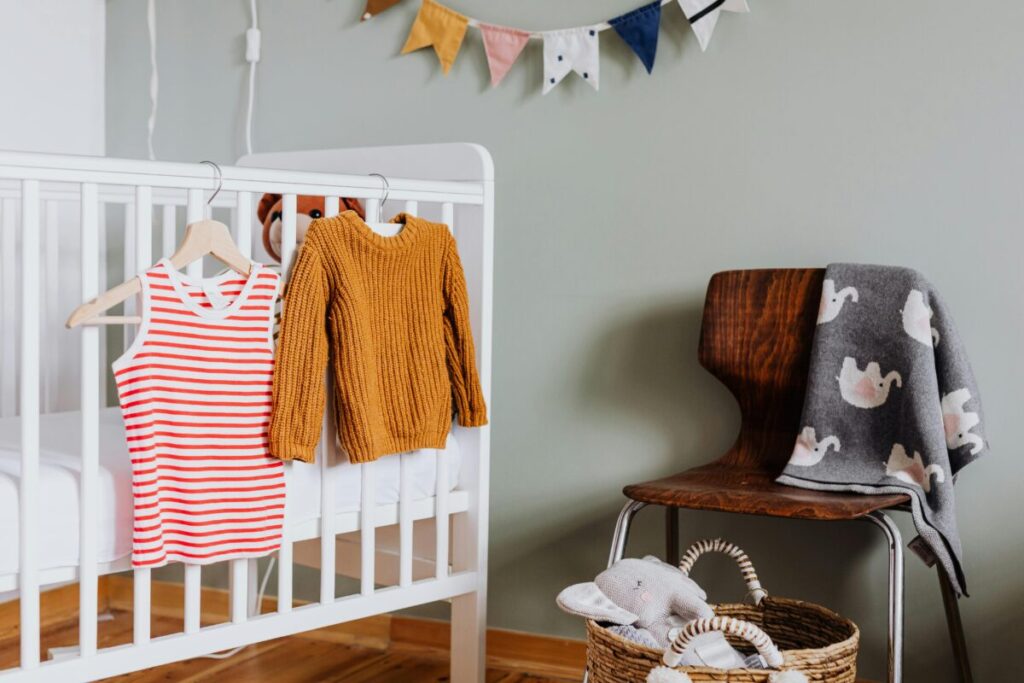 Organized baby nursery shelf with essential newborn gear and minimalist decor