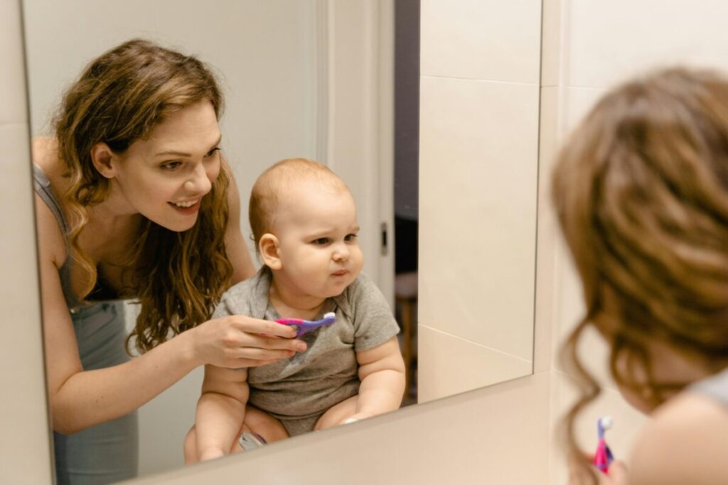 A parent providing baby teething relief that actually works by using a cold washcloth at night