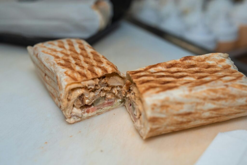 A delicious chicken shawarma wrap ordered as a late-night reward for a mom surviving a stressful toddler food strike at 15 months tips.