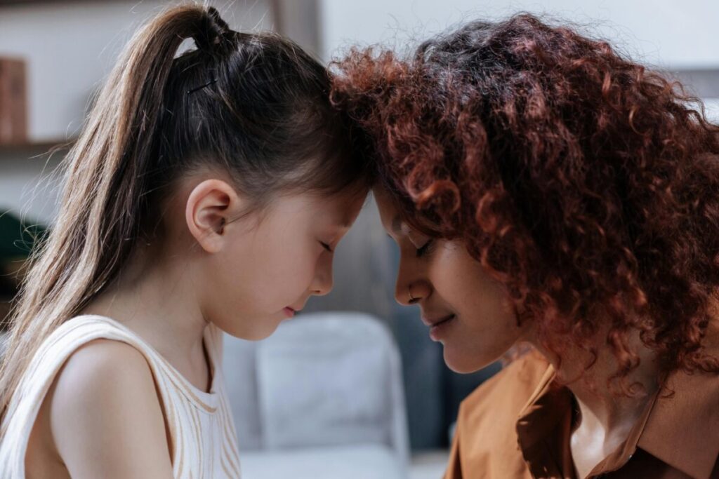 Parent connecting with a toddler at eye level to support emotional regulation and brain development