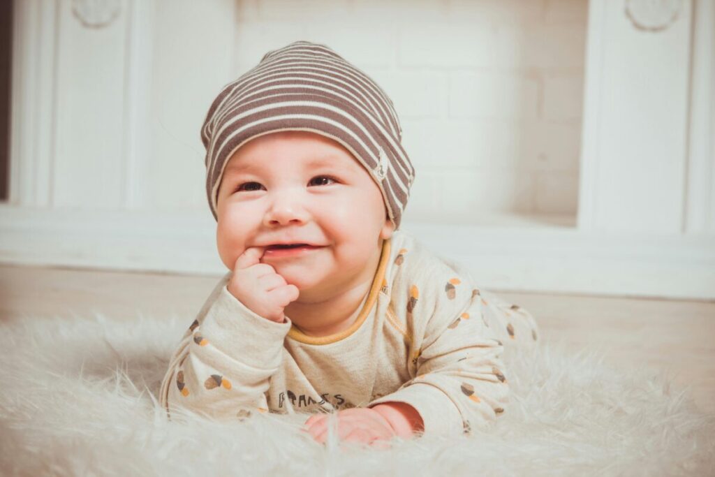 Messy baby with a wet bib during the teething drool-pocalypse phase.