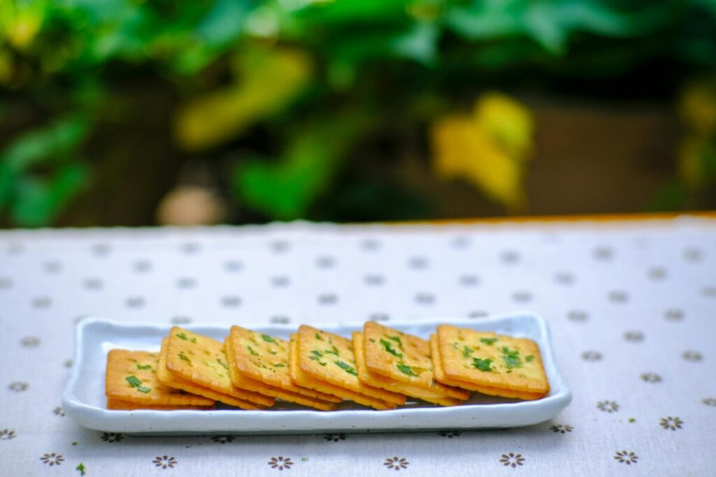 Close-up of crackers in a toddler lunch box, focusing on the texture and snack choices for nut-free daycare lunch ideas.