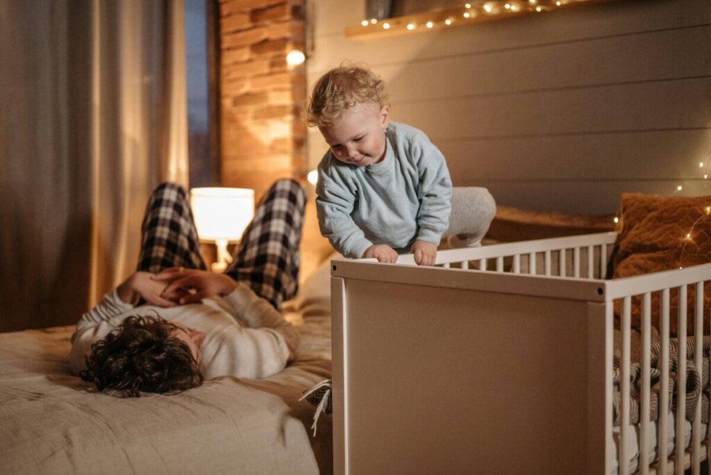 Toddler attempting to climb out of crib as a sign of crib to bed transition